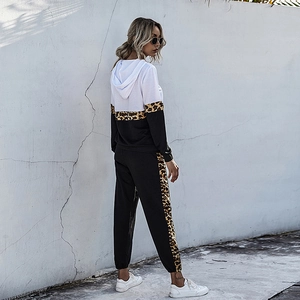 Women's two-piece tracksuit featuring leopard print patchwork hoodie and jogger pants