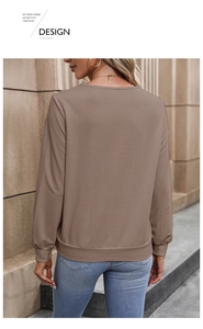 Detail of taupe v-neck sweatshirt with micro-pleated texture and ribbed hem for women