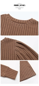 Detail of ribbed knit brown top showing crew neck and pleated shoulder craftsmanship