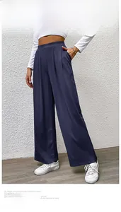 Detailed view of dark blue wide-leg pants featuring elastic waist and vertical ribbed texture
