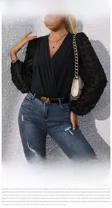 Detail of V-neck bodysuit featuring sheer sleeves with textured pom-pom jacquard fabric