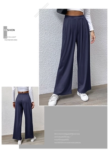 Detailed front and back view of dark blue wide-leg trousers with elegant pleated high waist