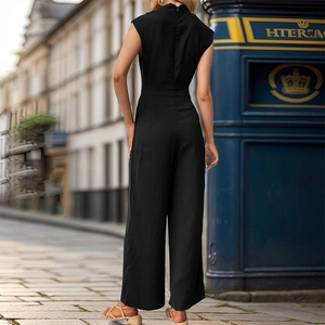 Macro detail of elegant back design and wide-leg silhouette on this sleeveless black jumpsuit