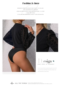 Detail of black V-neck bodysuit with sheer textured mesh puff sleeves and knit body