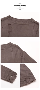 Detail view of dark brown knit sweater featuring distressed hole accents on the crew neck