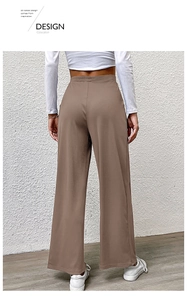 Detail of high-waist brown wide-leg trousers with vertical rib texture from back view