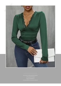 Detail of elegant dark green bodysuit with lace V-neck and ruched bust design