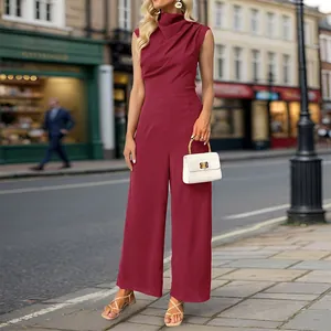 Detail of burgundy sleeveless jumpsuit with cowl neck and wide leg trousers in street style