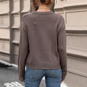 Distressed brown knit sweater with ripped details and long sleeves for casual street style