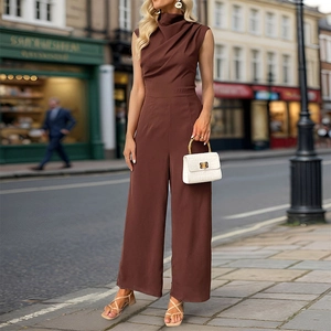 Detail of elegant dark brown sleeveless wide-leg jumpsuit with chic high cowl neck design
