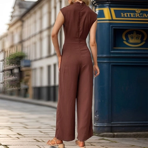 Detail of a brown sleeveless wide-leg jumpsuit showing back zipper and smooth fabric drape