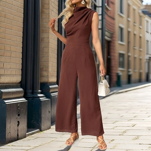 Detail of elegant chocolate brown cowl neck jumpsuit with a wide leg fit on a city street