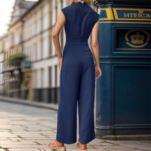 Detail of navy blue sleeveless jumpsuit featuring a back zipper and wide-leg trousers
