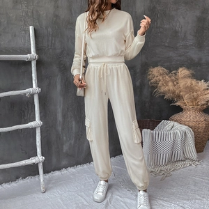 Detail of cream texture knit two-piece lounge set with cargo pocket and ribbed fabric