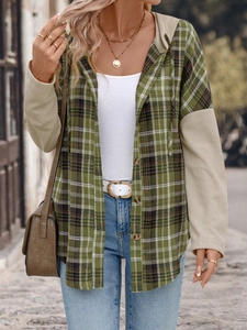 Detail of green plaid hooded shirt featuring khaki waffle knit sleeves and brown buttons