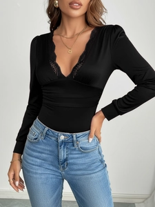 Elegant slim-fit black long sleeve bodysuit with lace V-neck and ruched waist detail