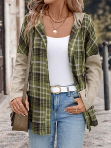 Detailed close-up of green plaid hooded shirt with beige waffle texture sleeves