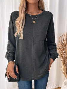 Close-up of dark grey long sleeve sweatshirt featuring a round neck and front pocket detail