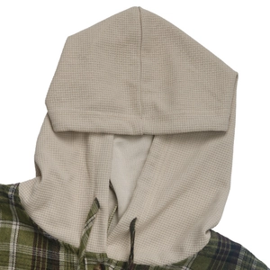 Detail of hooded plaid shirt with green check fabric and waffle knit hood texture