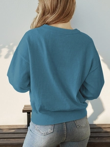 Back view of a casual blue round-neck long-sleeve knitted sweater for women
