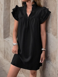 Detail of black V-neck summer dress with ruffled collar and layered sleeve texture
