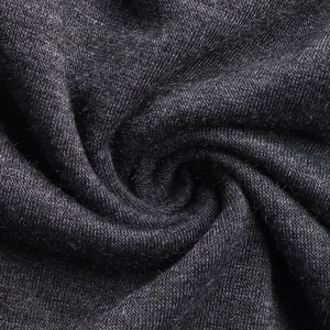Close-up of charcoal grey knit fabric texture showing soft cotton blend fibers