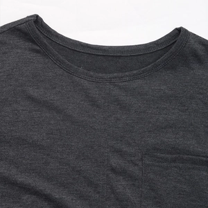 Detail of dark grey crew neck sweatshirt showing knit fabric texture and chest pocket