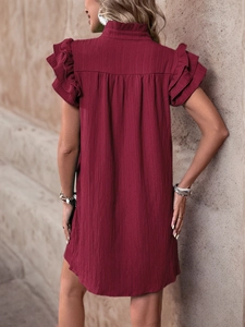 Detail view of burgundy tiered sleeve dress with vertical crinkle texture and ruffle high neck