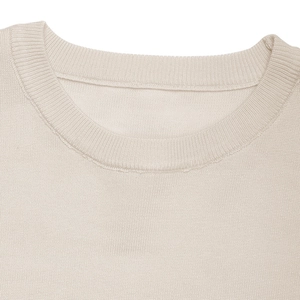 Detail of the ribbed crew neck and fine knit texture on a cream-white sweater
