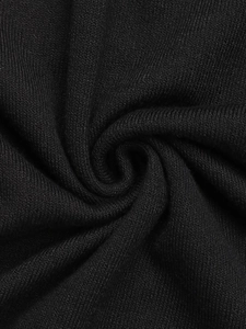 Detail of black fine knit fabric texture showing softness and ribbed material quality