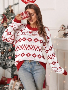 Detailed knit pattern of red and white Christmas sweater with festive reindeer jacquard