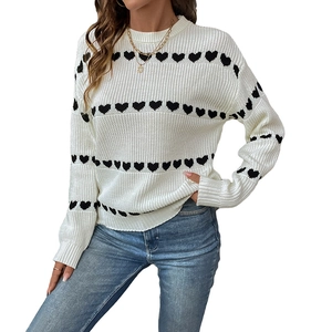 Women's white knitted heart sweater with crew neck and black heart patterns for casual wear