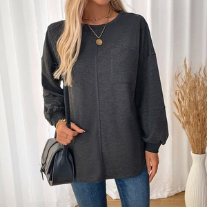 Women's long sleeve dark grey crewneck sweatshirt with decorative front seam and pocket