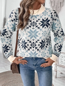 Détails du pull en tricot d'hiver avec motifs de flocons bleus et poignets côtelés