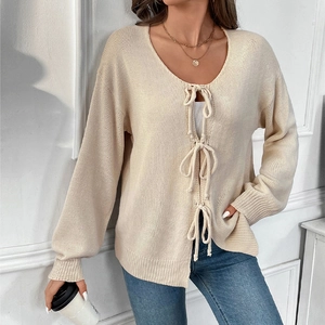 Beige knit cardigan for women with chic bow-tie closures and elegant V-neck design