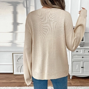 Beige loose casual knit sweater for women with ribbed cuffs and round neck back view
