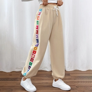Women's apricot sweatpants with colorful crochet floral side stripes and elastic waist