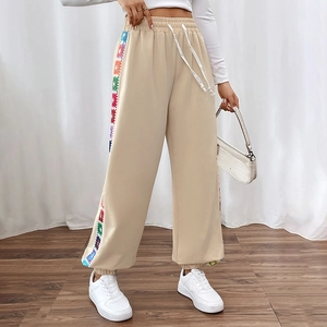 Beige joggers with rainbow crochet side stripes and drawstring waist for women