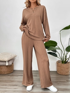 Detail of coffee brown loungewear set showing wavy texture and buttoned crew neck