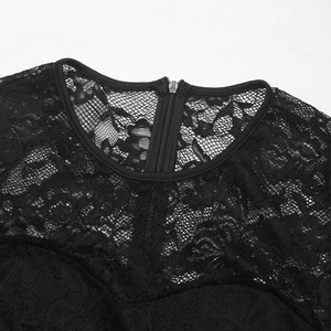 Detailed view of black floral lace neckline and back zipper closure of the jumpsuit