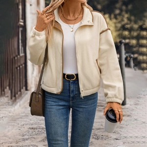 Women's cream zip-up fleece jacket with brown contrast piping and a stylish lapel collar
