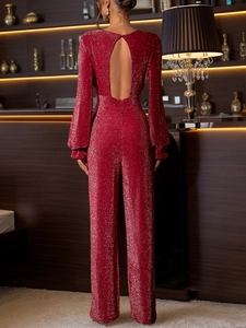 Detailed back view of backless red sequin jumpsuit with long sleeves and wide legs