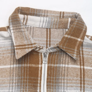 Detail of classic plaid shirt collar and durable silver metal zipper closure mechanism