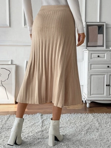Detail of pleated knit skirt with high waist design and fine vertical pleats for women
