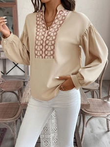 Elegant beige long sleeve V-neck blouse with bohemian chain embroidery and lantern sleeves
