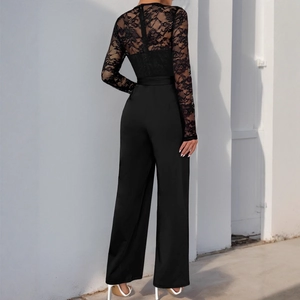 Elegant black long sleeve jumpsuit featuring floral lace patchwork and wide leg trousers
