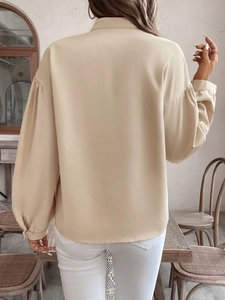Elegant beige long sleeve shirt with vintage patterns and lantern sleeves for women