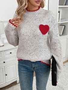 Women's white knitted sweater with red heart patch and wavy scalloped edge trim