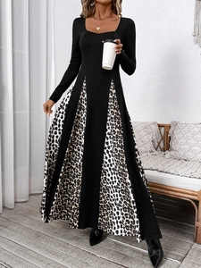 Detail view showing leopard print patchwork design and elegant A-line long skirt hem