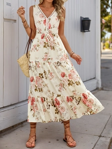 Detail of V-neck summer dress with lace trim, floral print and tiered skirt layers